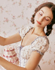 Close-up of Lacemade puff sleeve dress with lace trim detail