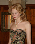 "Flower & Mirror" Close-up of black satin corset fabric and intricate floral motifs