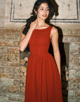 Side view of Pan's Cocktail burgundy red knit maxi dress with functional pockets