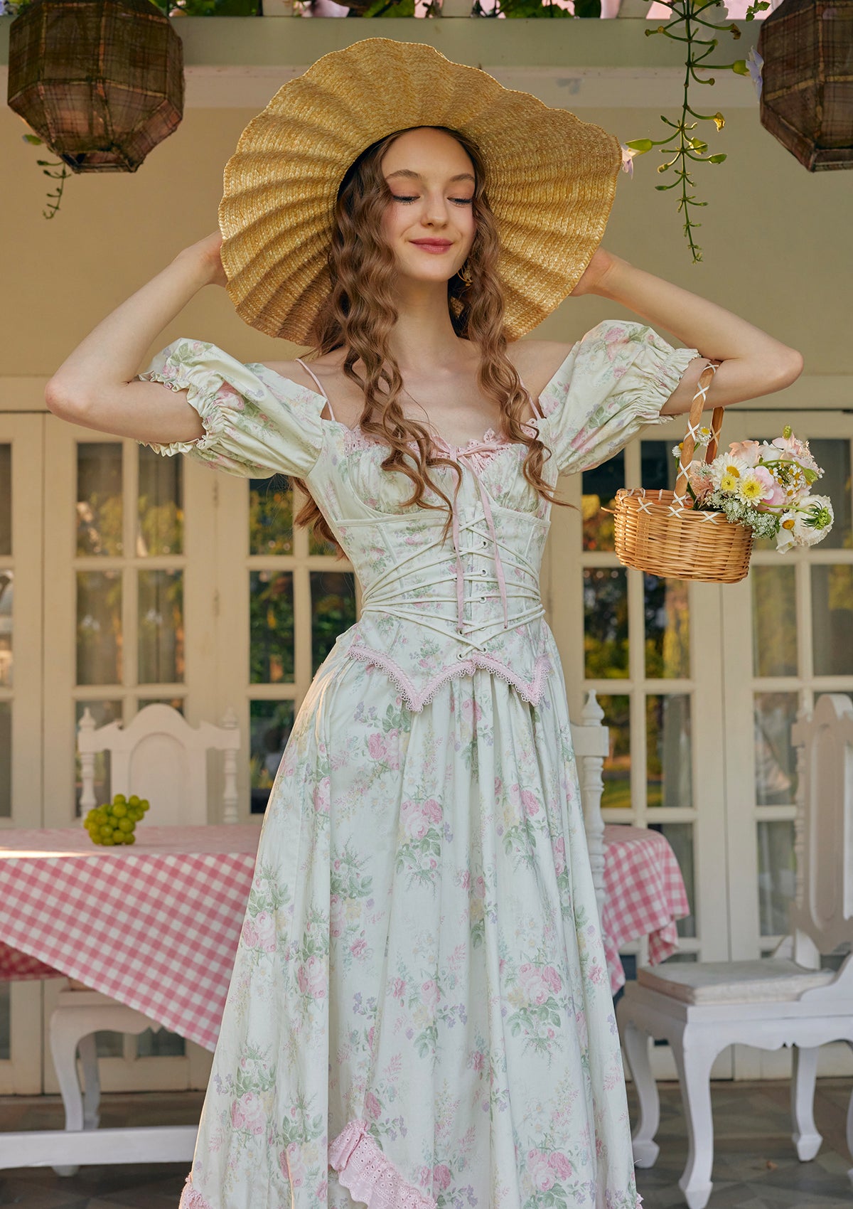 Close-up of pink lace trim and ribbon lacing on Lacemade floral dress