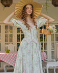Close-up of pink lace trim and ribbon lacing on Lacemade floral dress