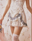 Close-up of ruffles and lace trim on Lacemade dollhouse mini dress