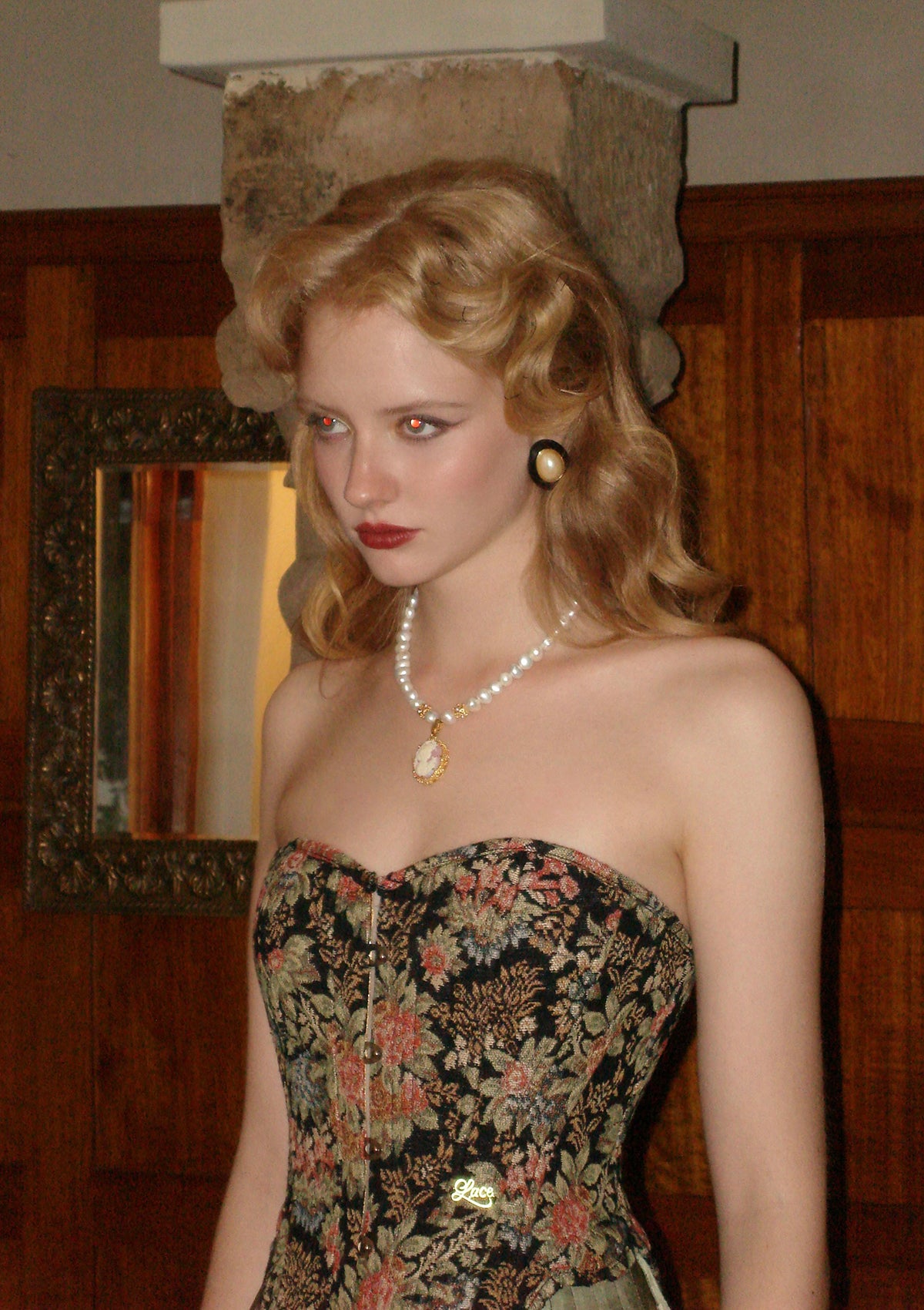 "Flower & Mirror" Close-up of black satin corset fabric and intricate floral motifs