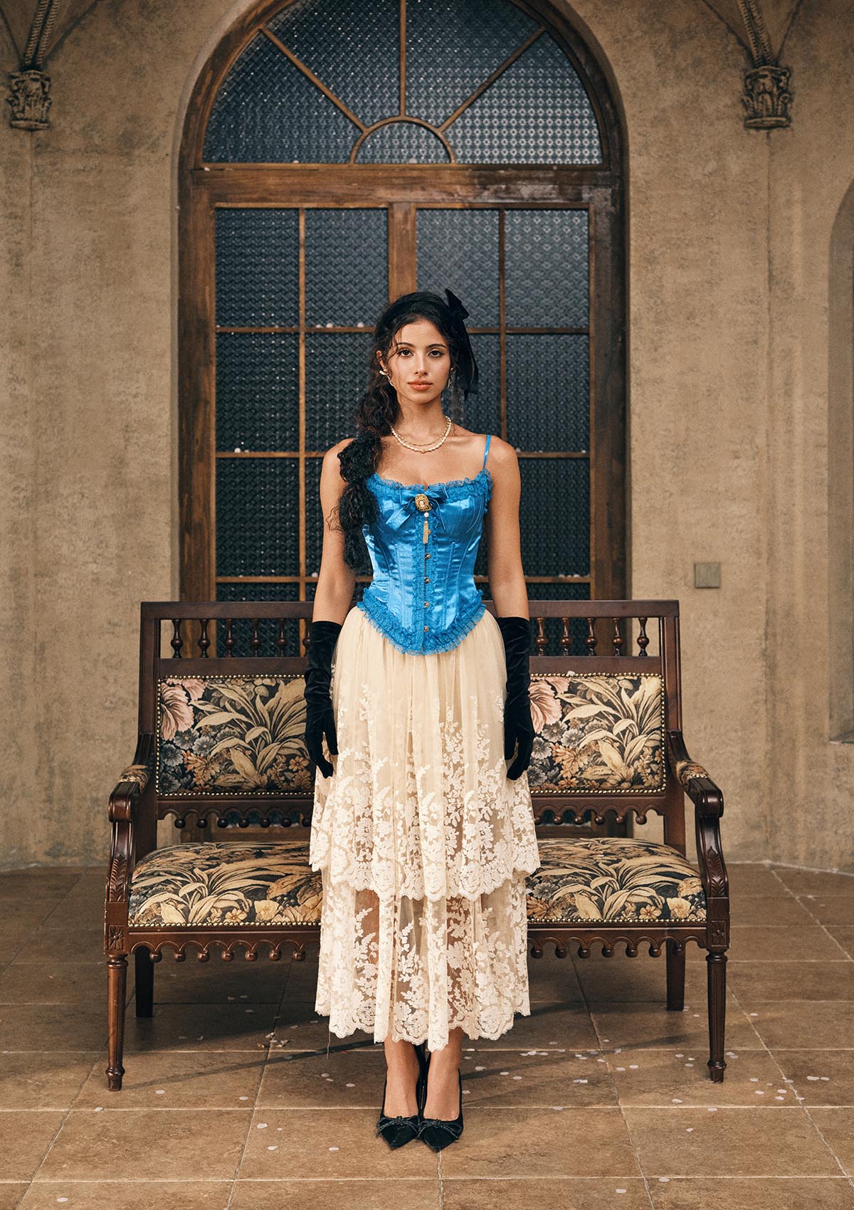 Front view of Sapphire blue satin corset with vintage lace trim