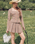 Front view of "St. Paul Crimson Berry" houndstooth pleated skirt