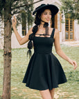 Front view of "Beyond Campus" black sleeveless A-line mini dress
