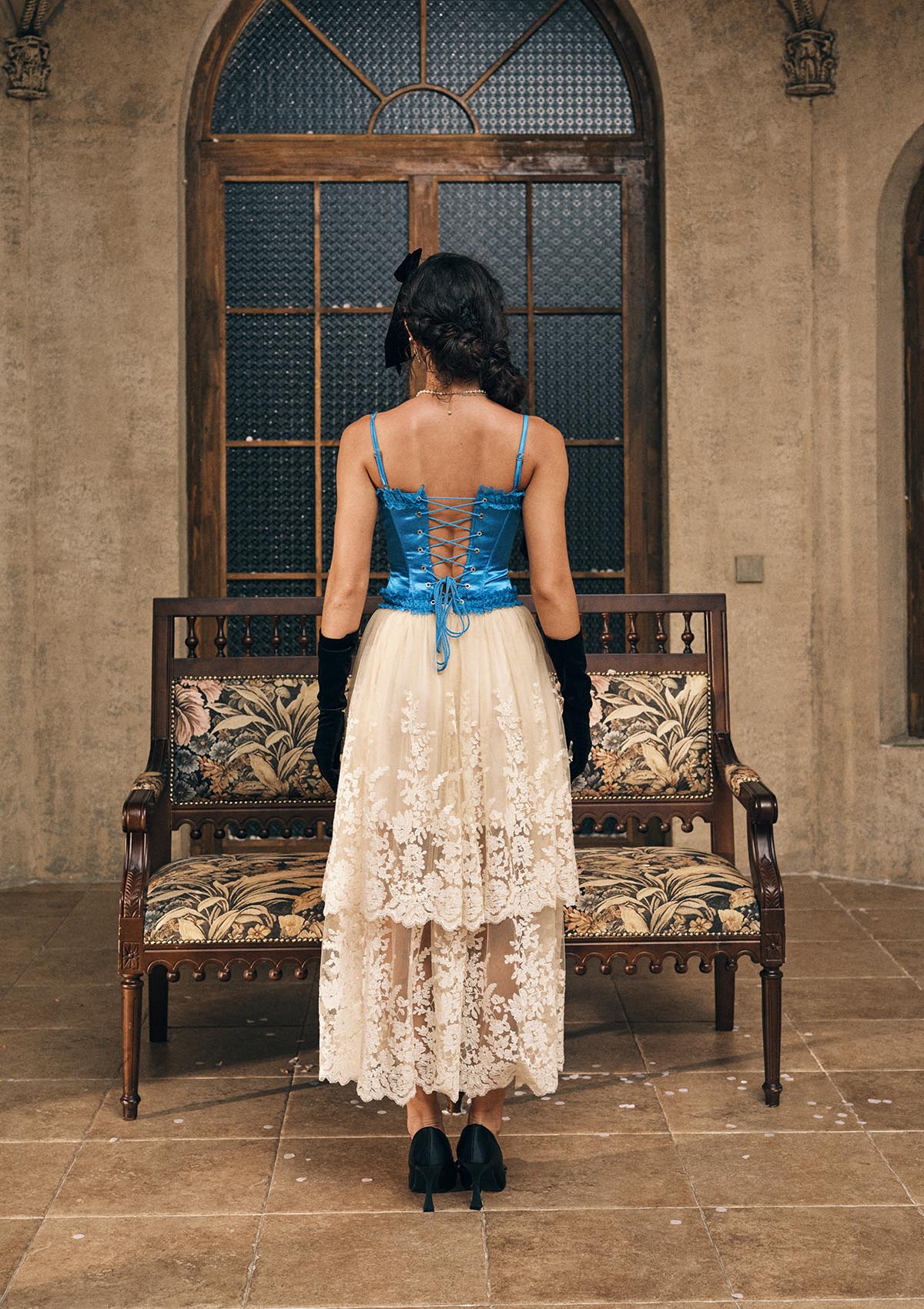 Back view of "Sapphire" blue satin corset featuring adjustable lace-up