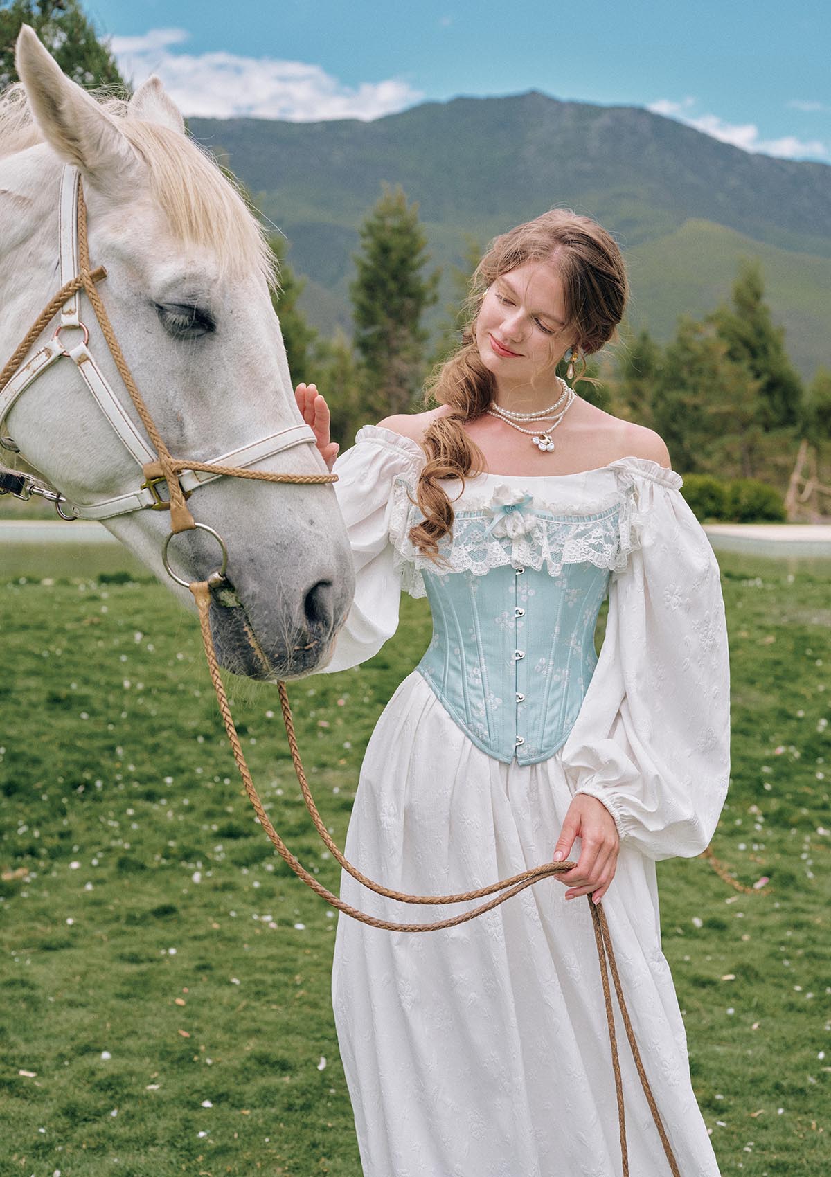 Front view of Moonlit Ice Castle corset with asymmetrical neckline