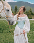 Front view of Moonlit Ice Castle corset with asymmetrical neckline