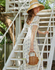 Lacemade flowy floral dress - Side view of blue vine print cotton midi